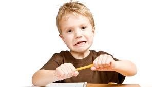 A child looking frustrated and snapping a pencil